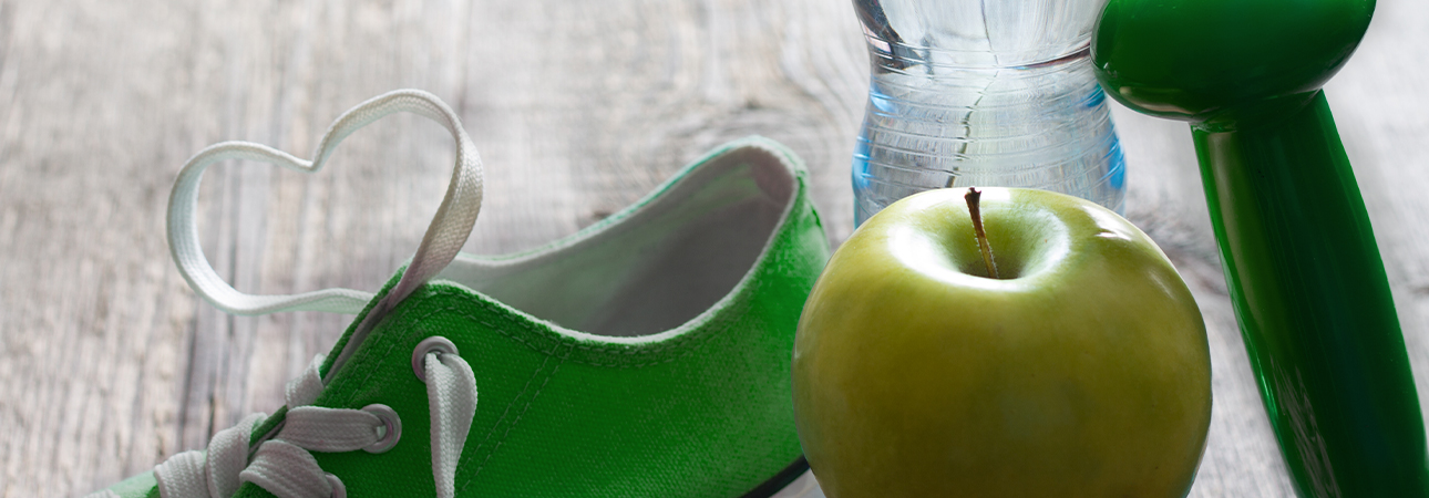 Image of a bottle of water, a shoe, and an apple