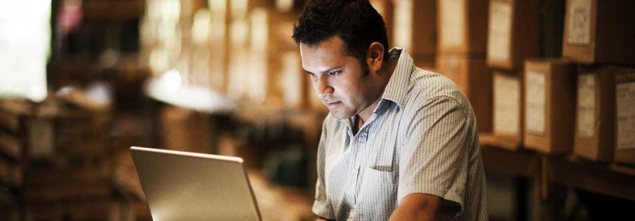 Man looking at a laptop intently