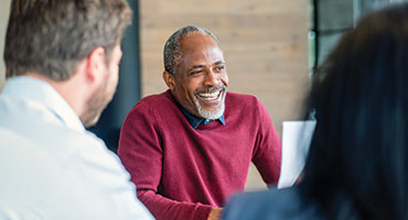 Woman with dog sitting on couch